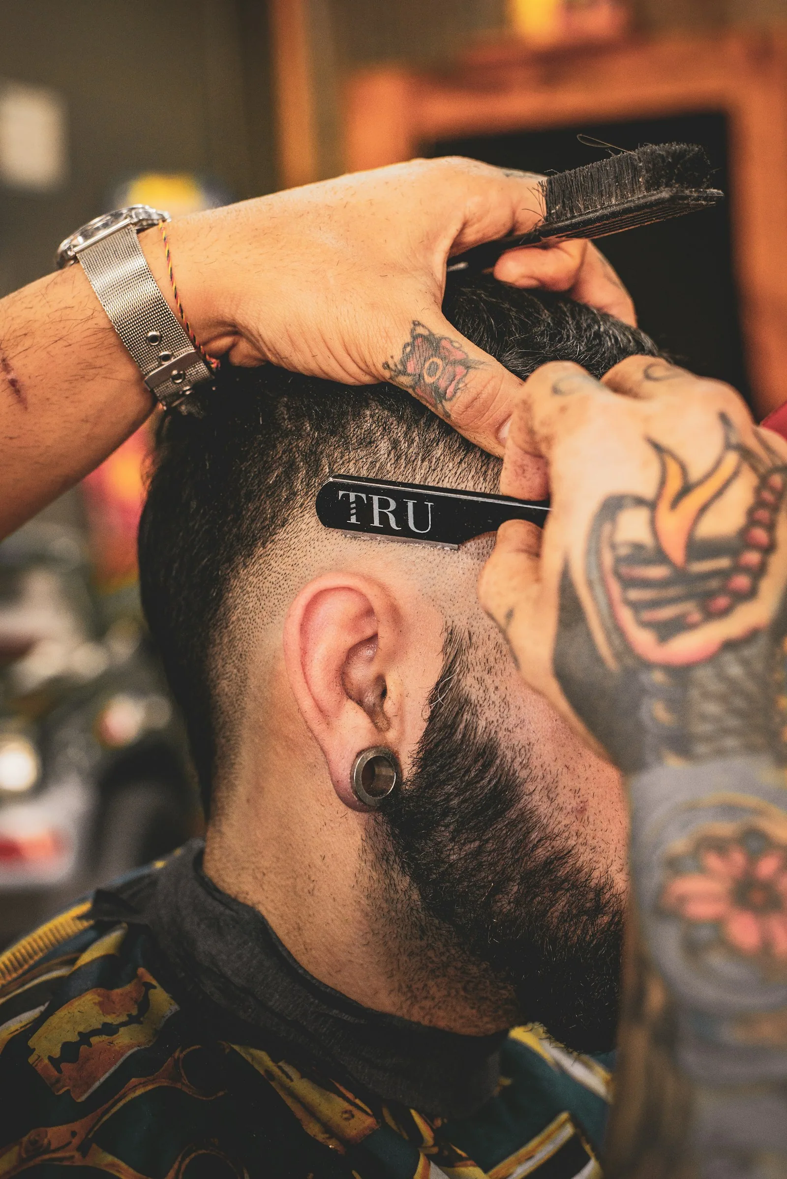 Barber refining a precision haircut
