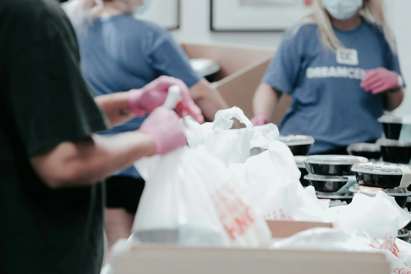 Volunteers packing food for neighbors